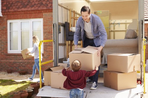 Professional movers loading furniture during removals in Millhill